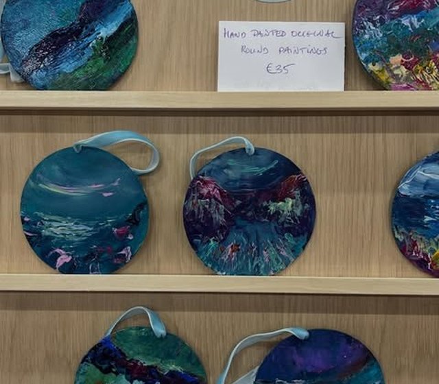 Hand painted round paintings on display