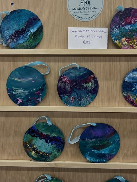 Hand painted decorative round paintings at Barna Art Fair 2025